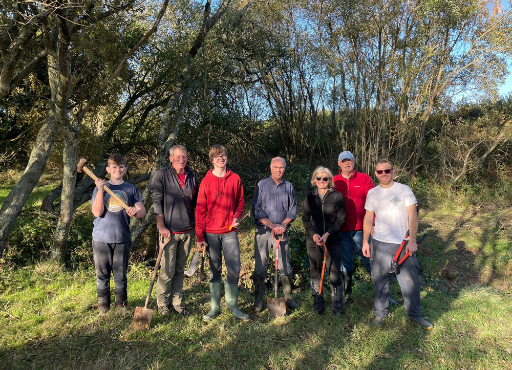 The team of volunteers with Luke, right