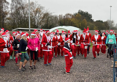 Santas taking part in the charity run after a warm-up, below Pictures: Wimborne Rotary