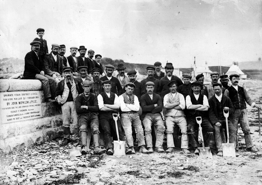 Pictures of the sea wall in 1905 and some of those who built