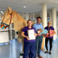 Richard Southam of Aquae Sulis Chiropractic (centre) with Katie and Lucy from the Kingfisher Ward play team