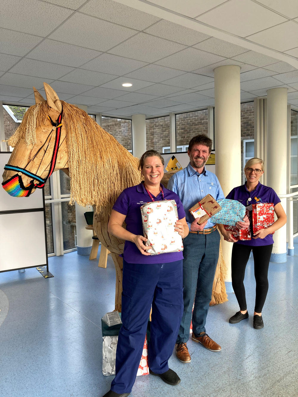 Richard Southam of Aquae Sulis Chiropractic (centre) with Katie and Lucy from the Kingfisher Ward play team