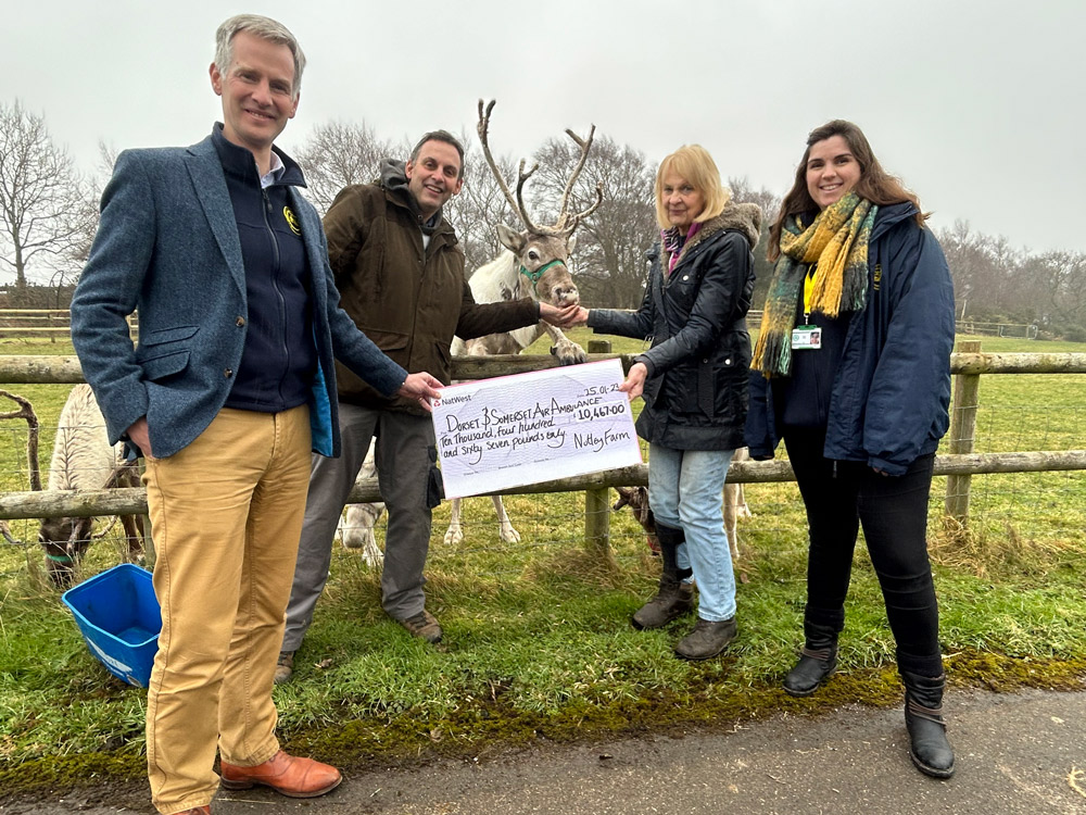 The Nutley Farm cheque presentation (from left): Dorset and Somerset Air Ambulance chief executive Charles Hackett, Julian Hubbuck, ‘Parsnip’ the reindeer, Anne Roots and charity supporter engagement officer Becky Heath