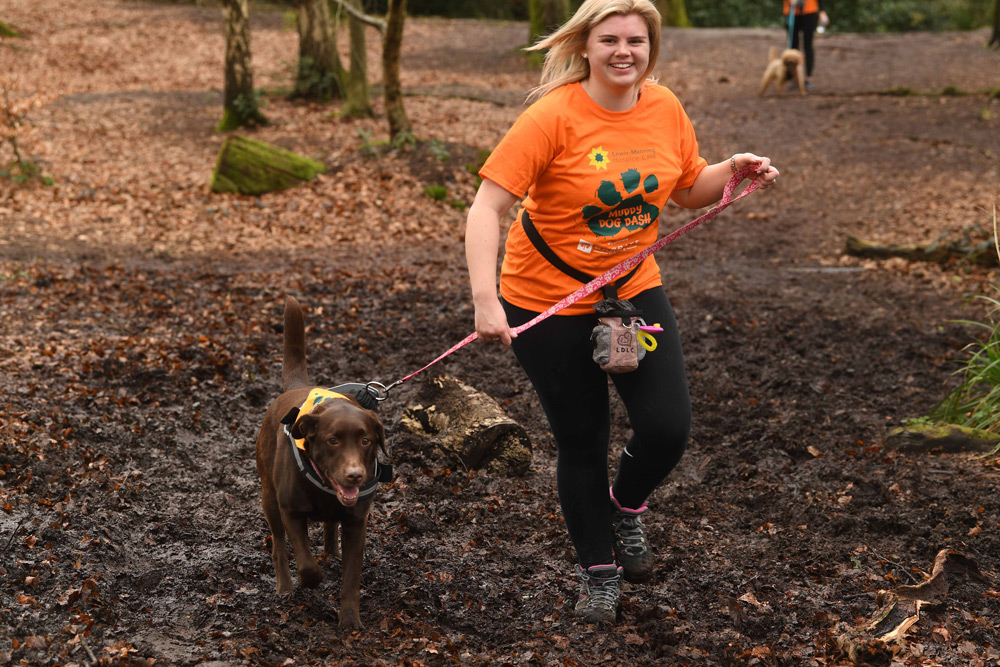 Daisy Kershaw and Poppy navigate the course at Upton Country Park on the Muddy Dog Dash