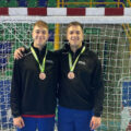 Alex Trent (left) and brother Joe wearing their bronze medals