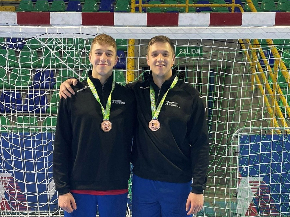 Alex Trent (left) and brother Joe wearing their bronze medals
