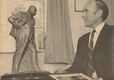 Sir Langford-Holt admiring the bronze maquette of Sir Winston Churchill