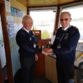 Martin Jones receives the station manager epaulettes PHOTO: Swanage NCI