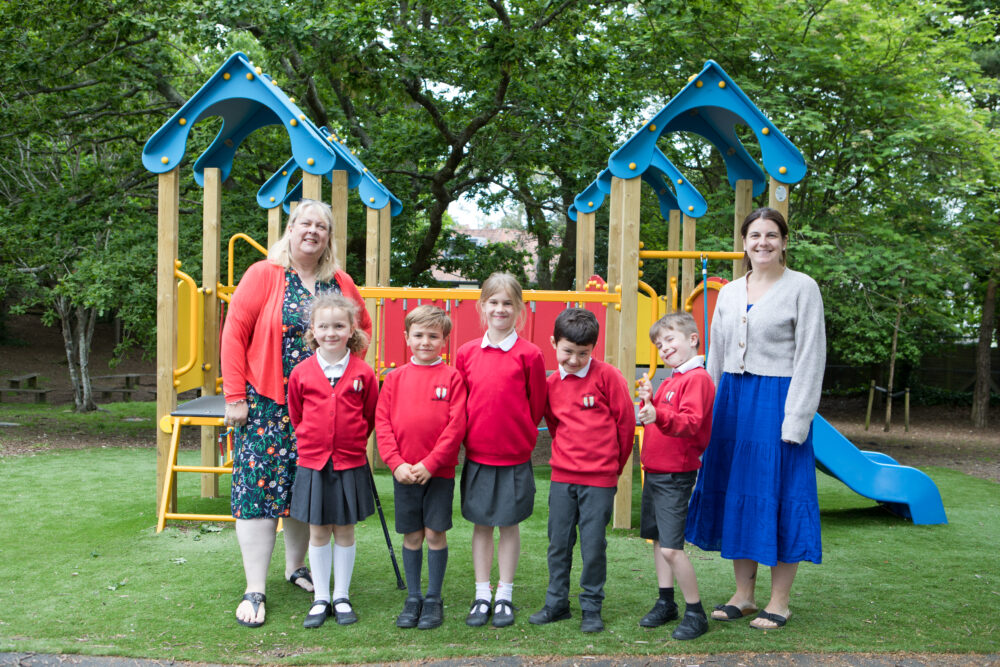 Pupils in the new area with headteacher Christine Chambers, right, and Louise Jones, grants manager at TVT, left