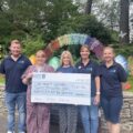 Dorset HealthCare staff hand over the £20,000 donation to Julia's House