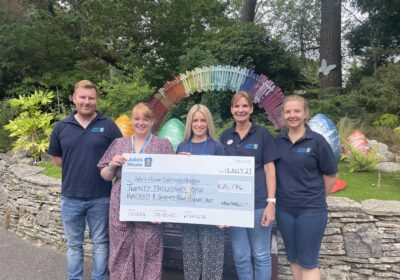 Dorset HealthCare staff hand over the £20,000 donation to Julia's House