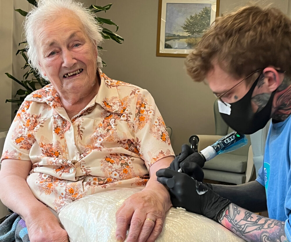 Nathan works on Hilda's new tattoo