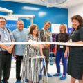 Patient Julie Hills cuts the ribbon at the new Poole Hospital Theatres