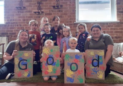 Staff and youngsters celebrate the Ofsted rating at Tops Charminster