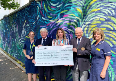 Weymouth Golf Club captains Simon Etherington, second left, and Pat Crane, second right, with Vicki Kingston, DCH Charity fundraising administrator, centre, and members of the Fortuneswell Ward and Paediatric Diabetes teams