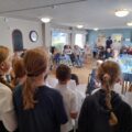 Hamworthy Park Junior School youngsters singing at Dorset House