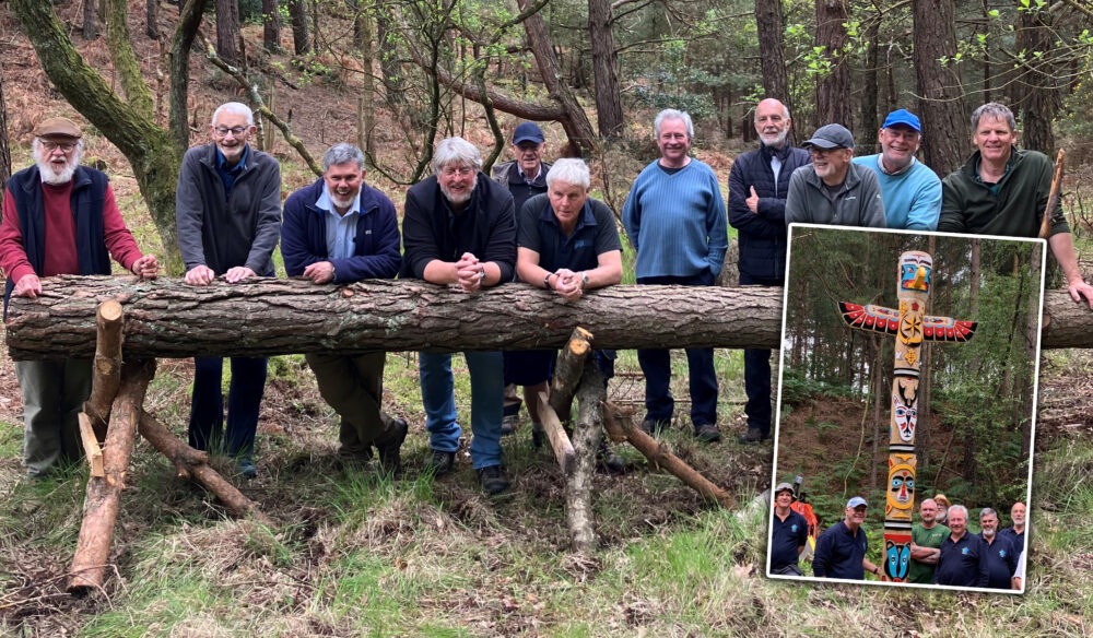 Members of the Men's Shed group with the log that became the amazing totem pole, inset