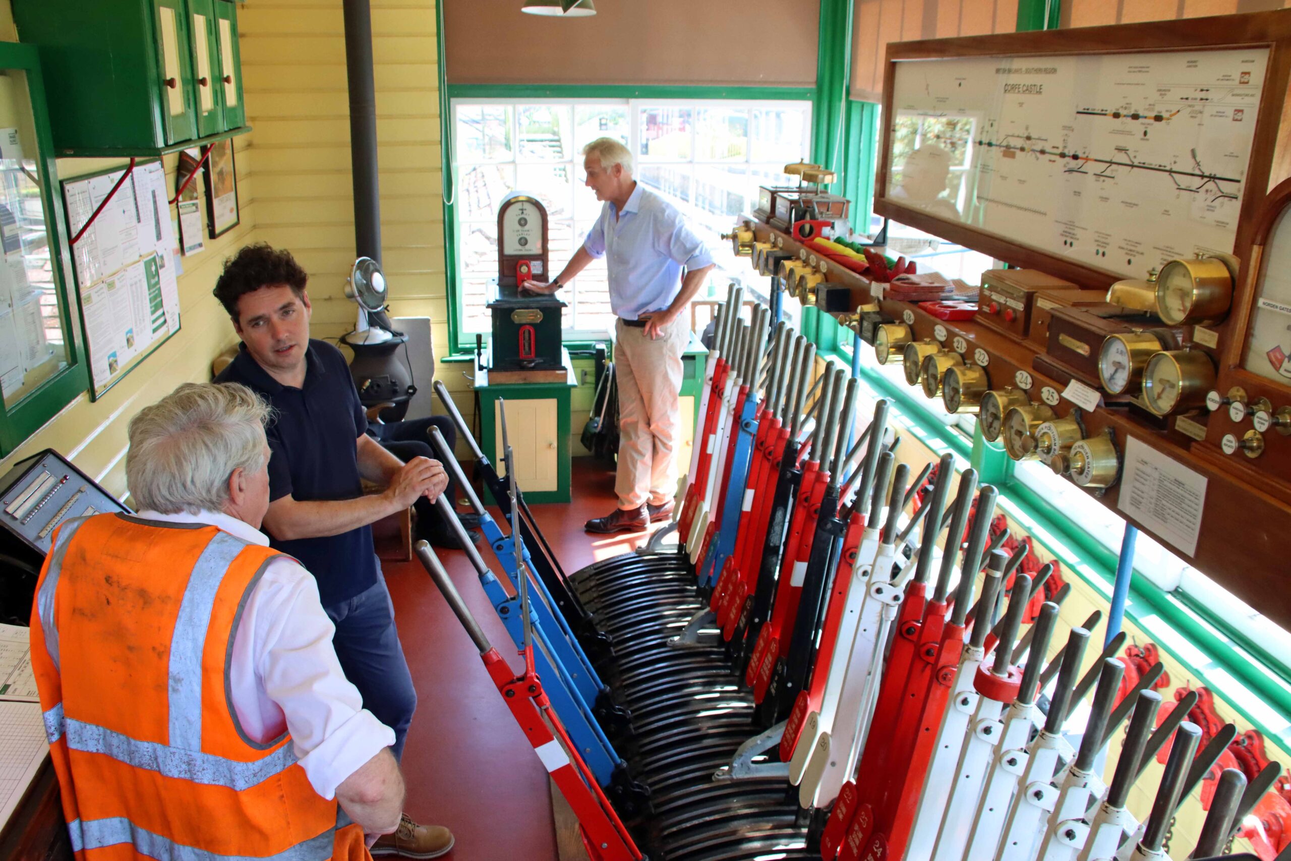 Mr Merriman and Mr Drax are shown around the signal box at Corfe Castle. Pictures: Andrew PM Wright