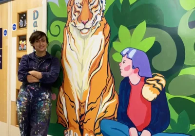 Marina Renee-Cemmick with her Mural on Kingfisher Ward