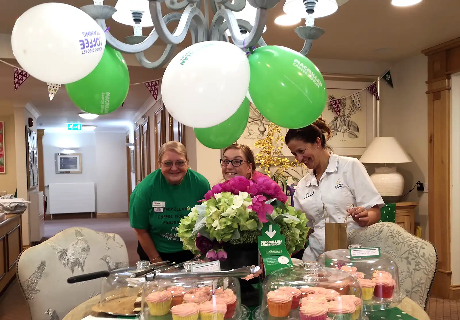 All smiles for the Macmillan Coffee Morning at Brook View are, from left, Colten Companion Christine Dunscombe, Companionship Team Leader Lauren Parrett and Clinical Lead Mel Berry