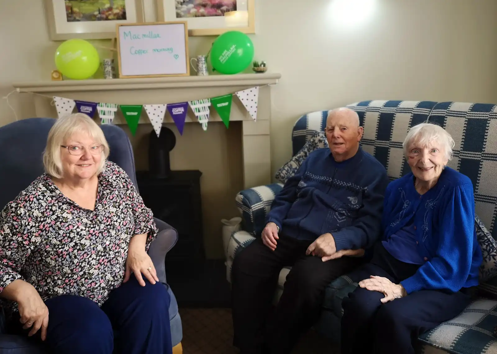 Jackie Cornish, left, daughter of Brook View residents Len and Diana Pearce, on her visit to the West Moors home for the Macmillan Coffee Morning