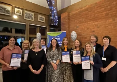 Carers leads and GP practice representatives who were recognised at the event pictured alongside carer Christine Carter, and Harriet Stevens, BCFC project lead and carers engagement facilitator