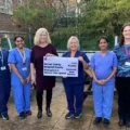 Gillian Wallace, Chair of Cattistock Open Gardens (third from left) presenting the cheque to staff from the hospital’s Critical Care Unit, supported by Vicky Hunt, DCH Charity (far right)