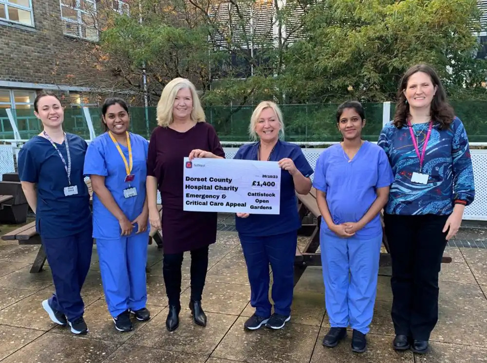 Gillian Wallace, Chair of Cattistock Open Gardens (third from left) presenting the cheque to staff from the hospital’s Critical Care Unit, supported by Vicky Hunt, DCH Charity (far right)