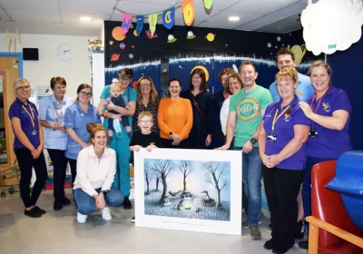 Katie (centre, with orange top) with Lorna to the right (in black) and Clare Hollingsworth to the left and members of the Kingfisher team