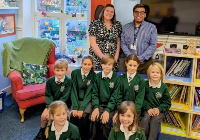 Corfe Castle Primary School headteacher Amy Howe, back left, with deputy Robert Stoner and pupils