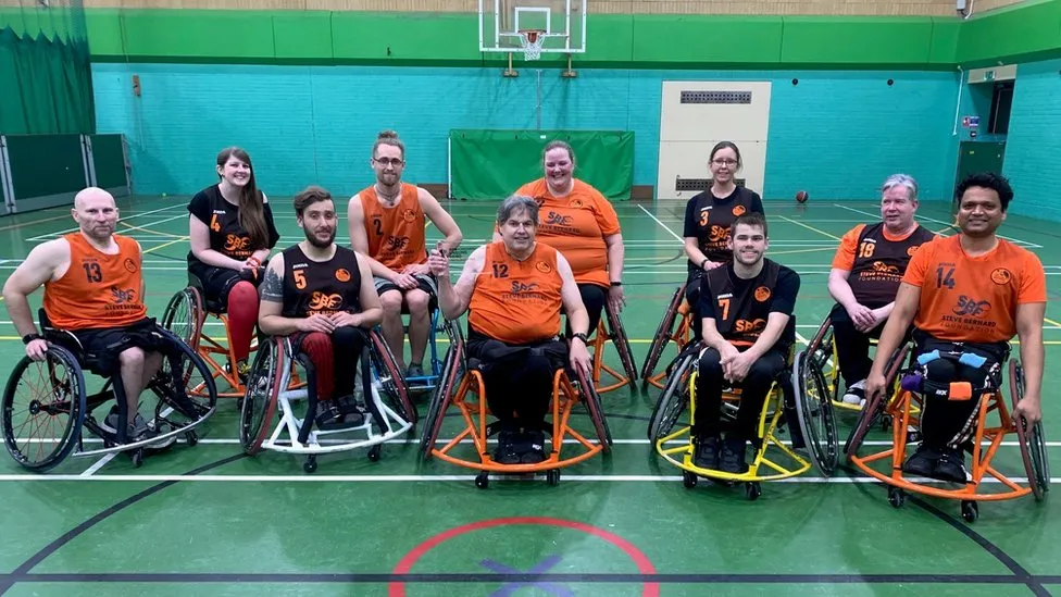Terry with members of the Dorset Demons basketball team. Picture: BBC