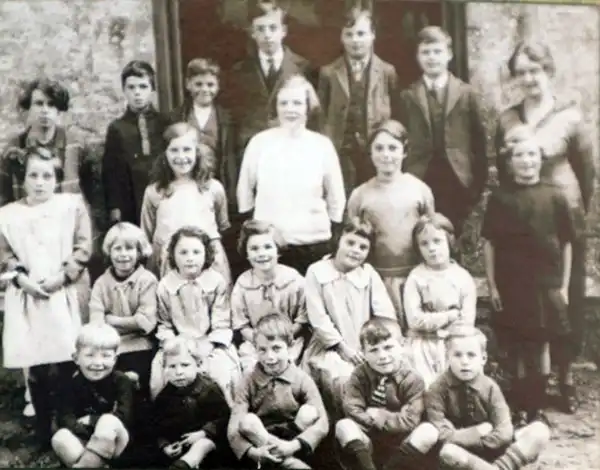 Peter, second from left in the front row, at the age of four outside Tyneham school