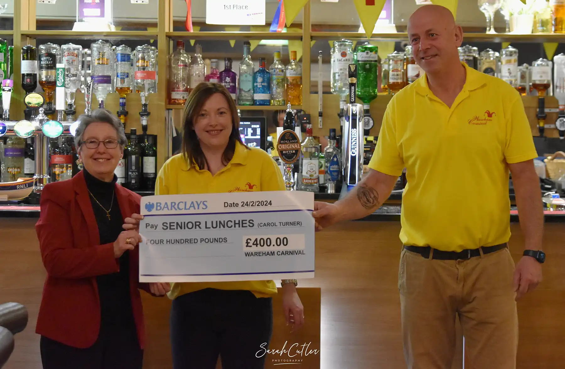 Wareham mayor, Carol Turner, receives a cheque to support lunches she organises. Picture: Sarah Cutler