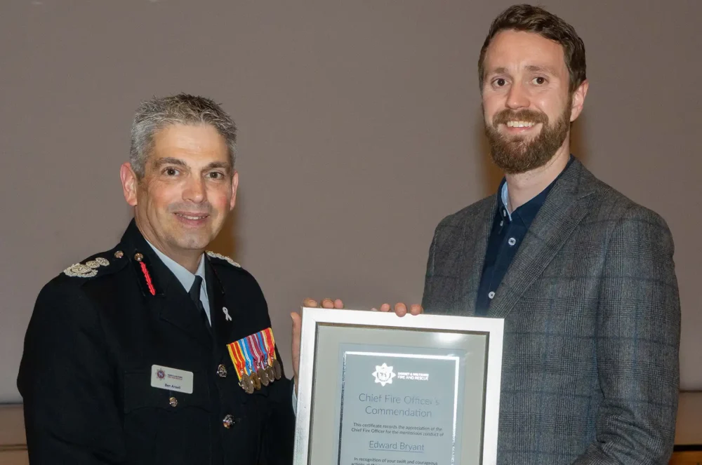 Edward Bryant, of Wimborne, received his award from CFO Ben Ansell. Picture: DWFRS
