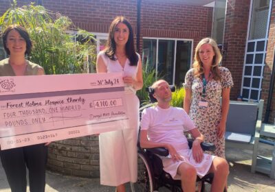 Danny Fudge-Harman from Danny's MND Foundation presenting a cheque to Forest Holme Hospice Charity CEO Hannah O' Hare Picture: Danny's MND